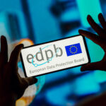 Photo of European Data Protection Board (EDPB) logo is displayed on a smartphone screen.